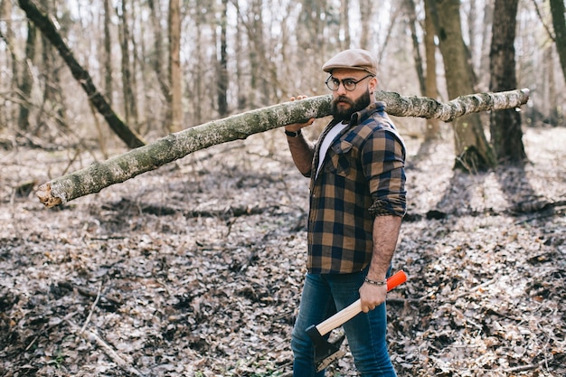 Handsome man in glasses holding log