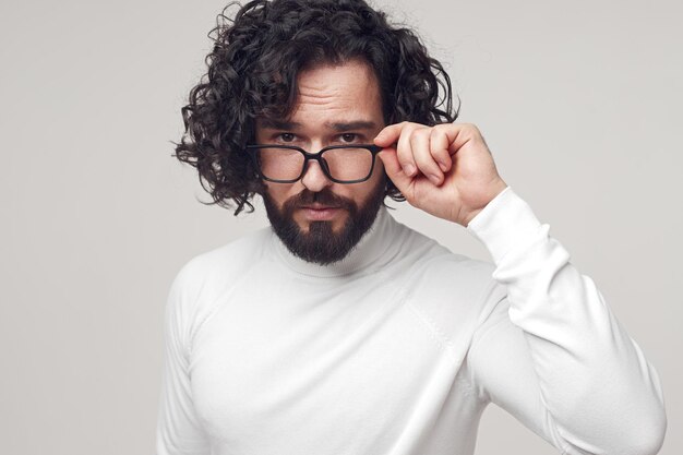 Handsome man in glasses looking at camera