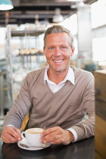 Handsome man having a coffee