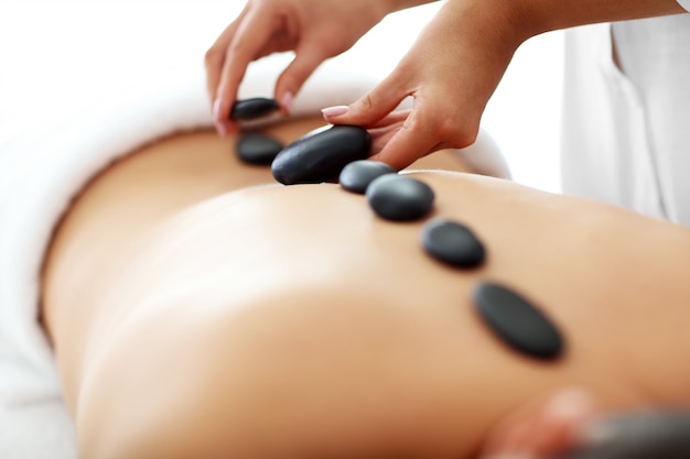 handsome man having massage in spa salon