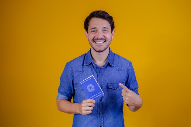 Handsome man holding a  brazilian passport