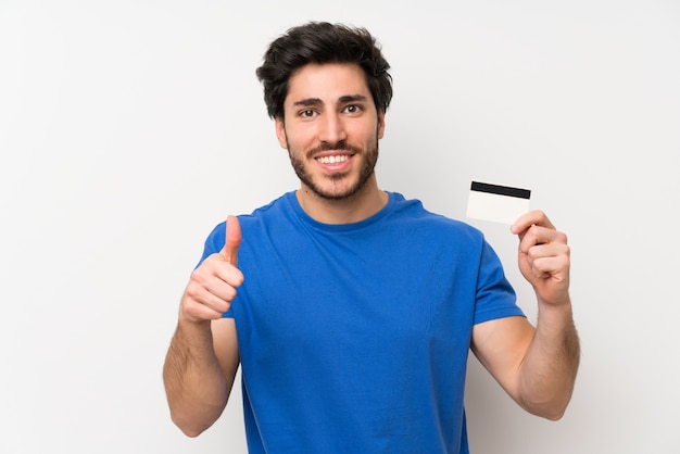Handsome man holding a credit card