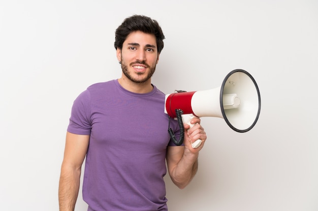 Handsome man holding a megaphone