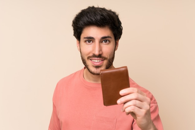 Handsome man holding a wallet