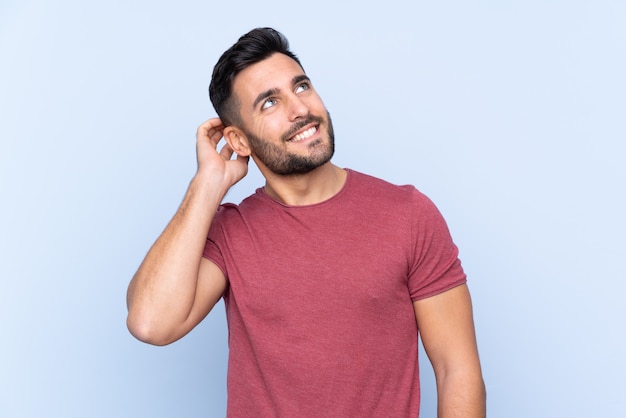 Handsome man over isolated blue