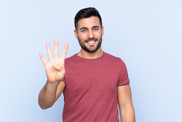 Handsome man over isolated blue