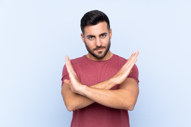 Handsome man over isolated blue