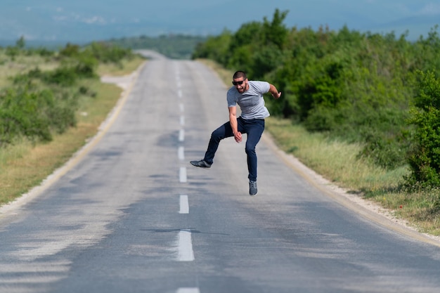 Handsome Man Jumping at Street Highway and Having Fun Outdoors