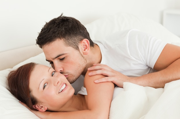 Handsome Man kissing his wife on the cheek