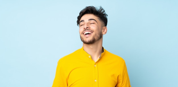 Handsome man laughing in studio