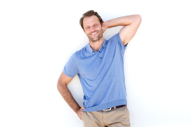 Handsome man laughing with hand behind head