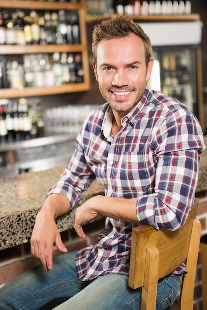 Handsome man leaning on counter