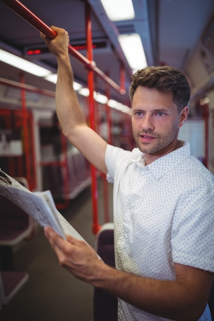 Handsome man listening music on mobile phone