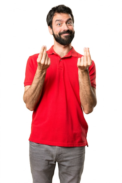 Handsome man making money gesture