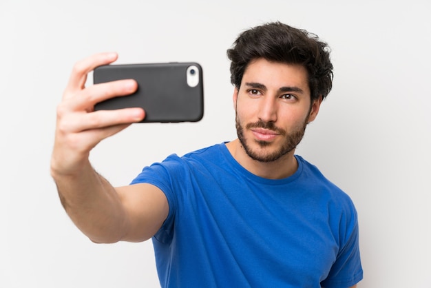 Handsome man making selfie with cellphone