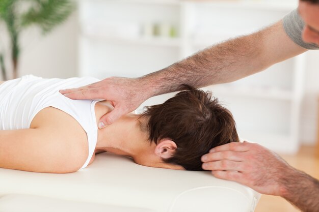 Handsome Man massaging a woman's neck