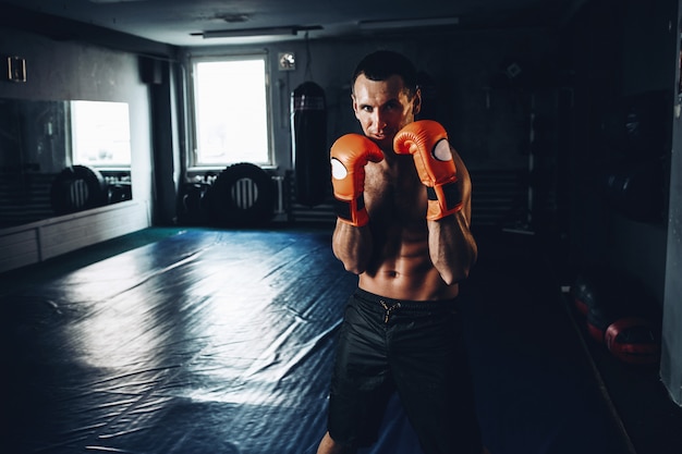 Handsome Man In Orange Boxing Gloves