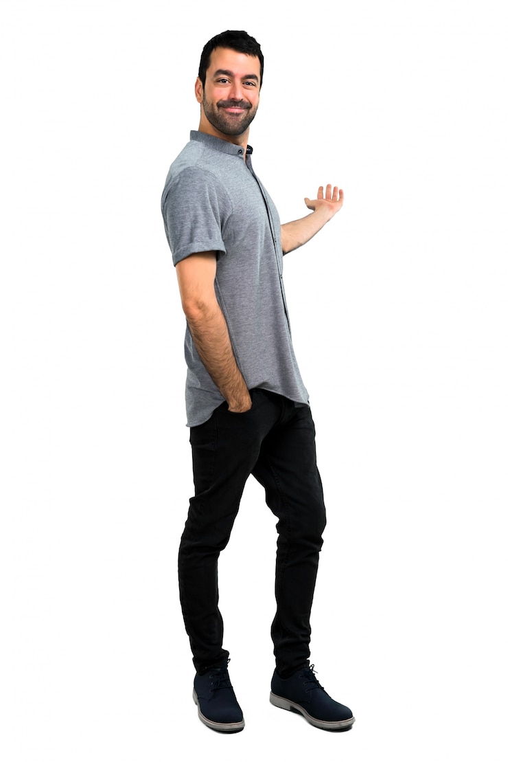 Photo handsome man pointing back with the index finger