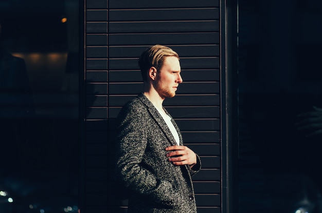 Handsome man posing in coat