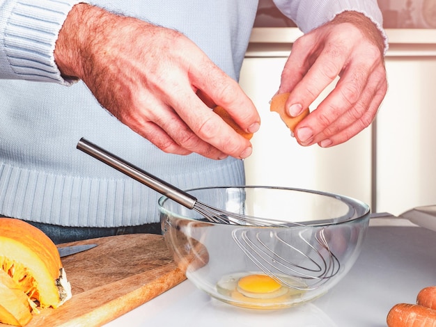 Handsome man preparing a healthy breakfast. Closeup, indoor