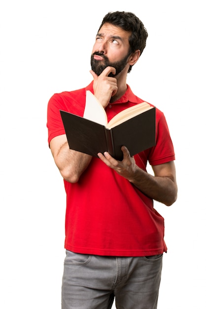 Handsome man reading a book