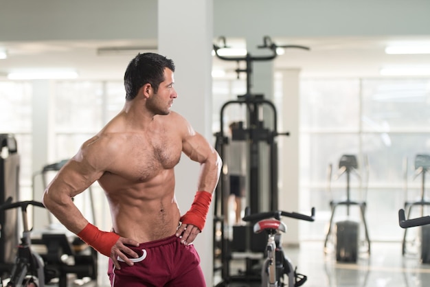 Handsome Man In Red Boxing Gloves  Boxing In Gym  The Concept Of A Healthy Lifestyle  The Idea For The Film About Boxing