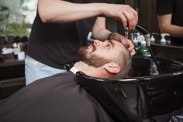 Handsome man relaxed in a barbershop