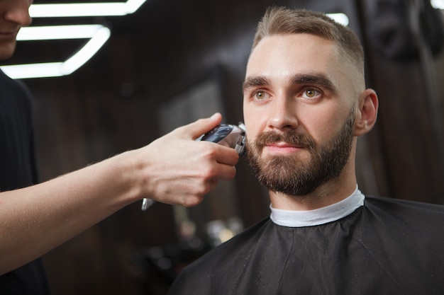 Handsome man relaxed in a barbershop