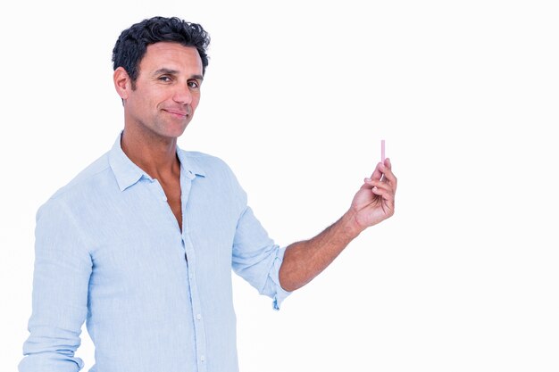 An handsome man showing Chalk 