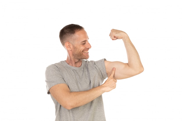 Photo handsome man showing his bicep