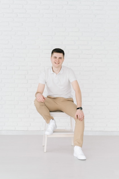 Handsome man sitting on a chair