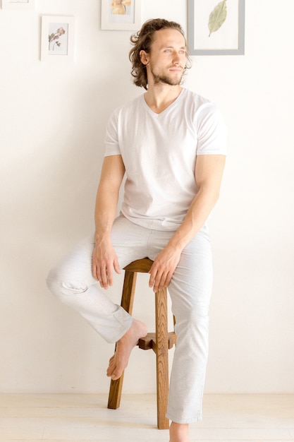 Handsome man sitting on a chair