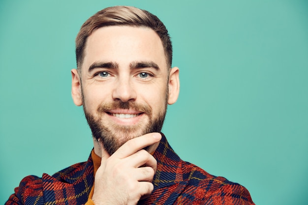 Handsome Man Smiling on Blue