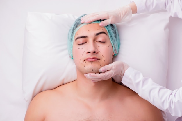 Handsome man in spa massage concept