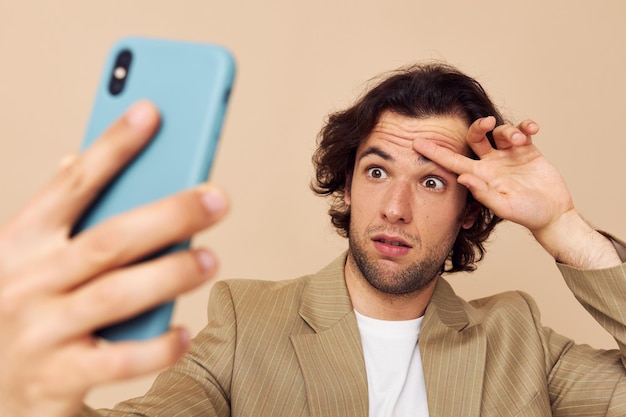 Handsome man takes a selfie classic style technologies isolated background