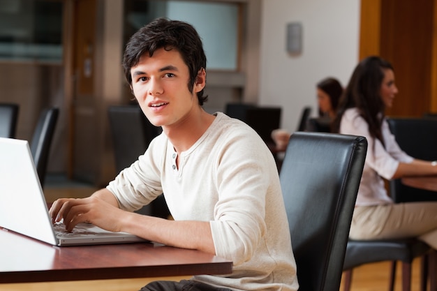 Handsome man using a laptop