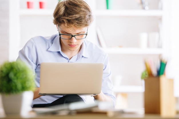 Handsome man using laptop