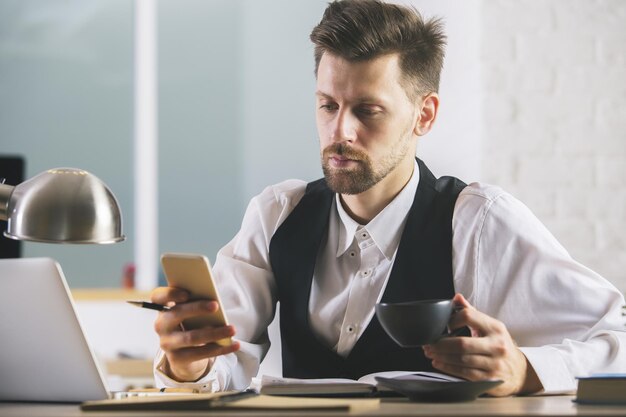 Handsome man using smartphone