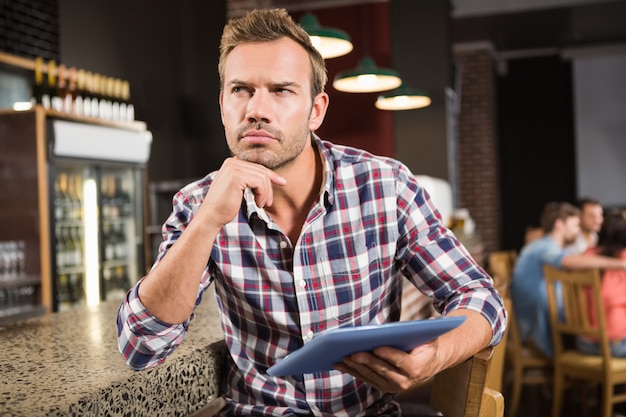 Handsome man using tablet computer