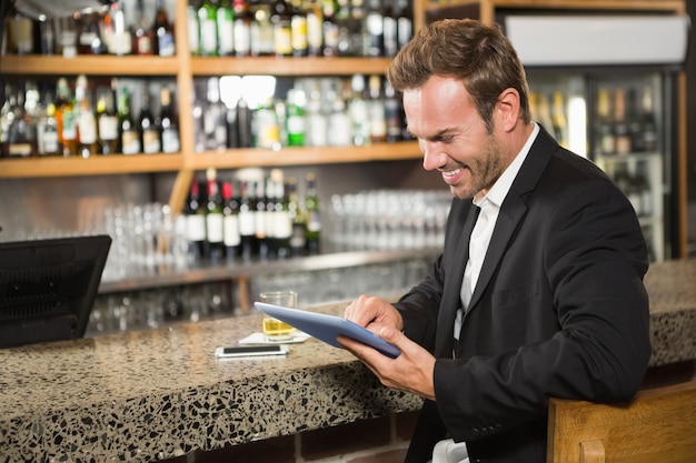 Handsome man using tablet computer