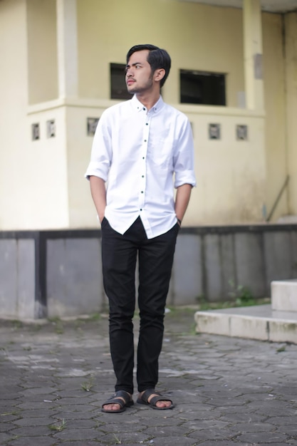 Premium Photo  Handsome man wearing formal casual wear white shirt and black  pants