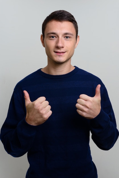 handsome man wearing sweater white