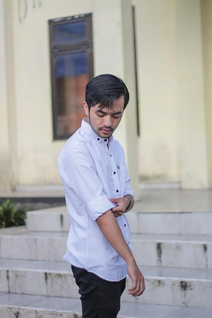 Handsome man wearing white shirt and black pants Formal Casual