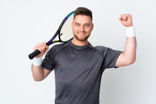  handsome man on white wall playing tennis and celebrating a victory