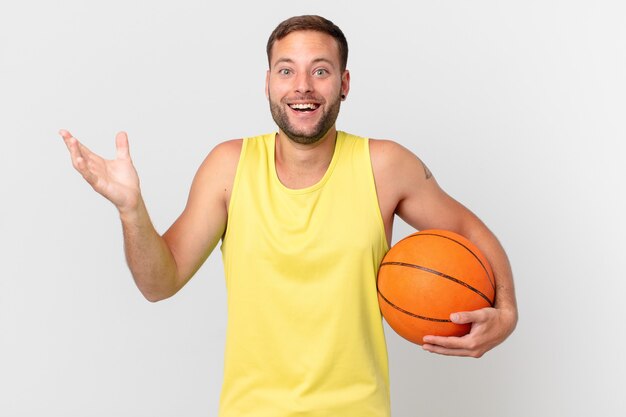 Handsome man with a basketball ball