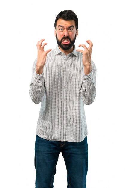 Foto l'uomo bello con la barba si è infastidito arrabbiato nel gesto furioso