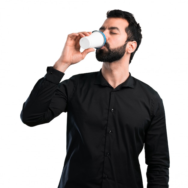 Handsome man with beard coffee to take away on white background