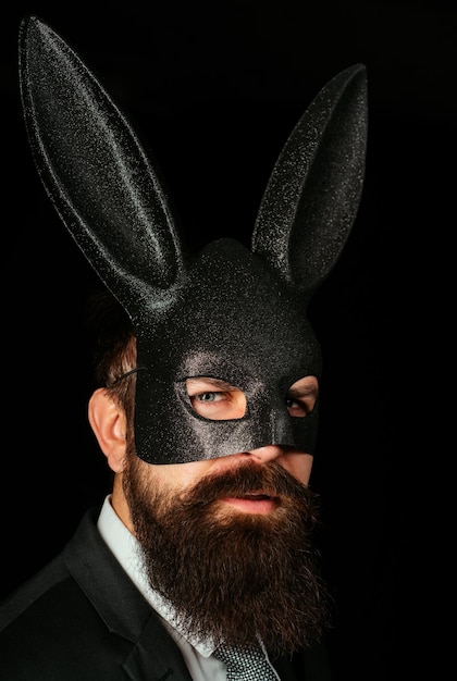 Handsome man with beard in playboy mask hipster with moustache handsome stylish bearded man serious