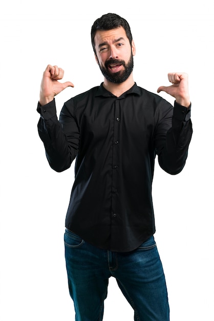 Handsome man with beard proud of himself on white background