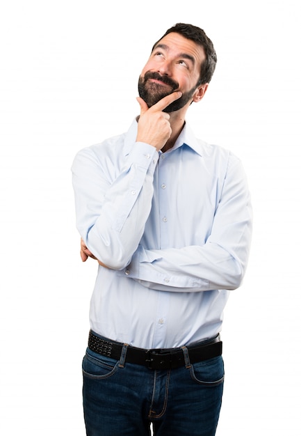 Handsome man with beard thinking